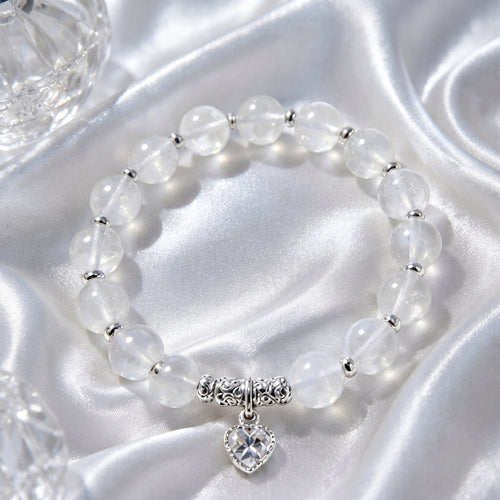 Armband aus durchscheinenden Kristallperlen mit silbernem Herz-Anhänger